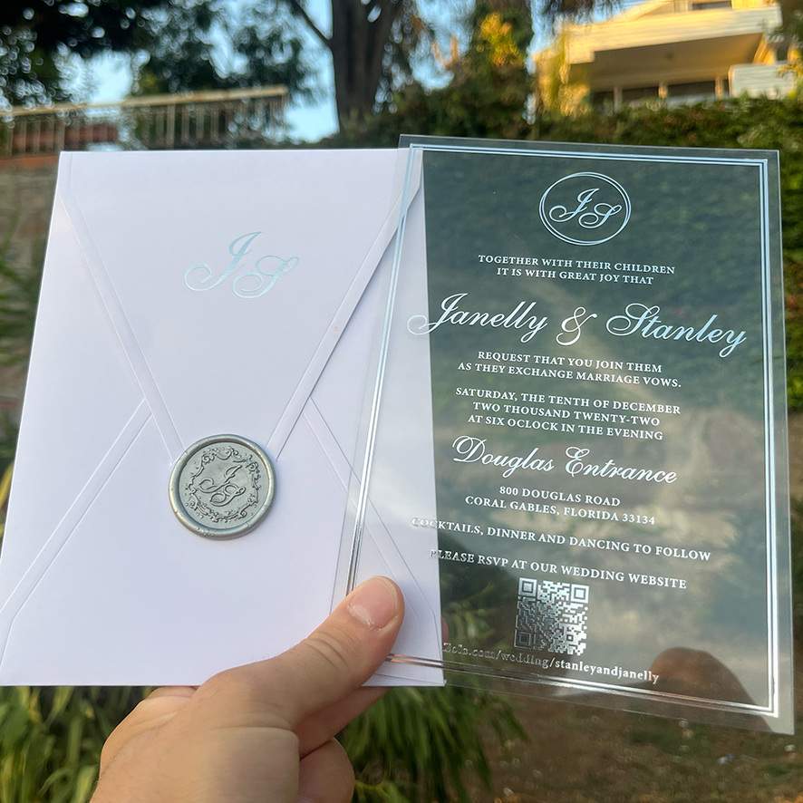 Clear Acrylic wedding invitation. White envelope. Silver foil print. Silver wax seal 